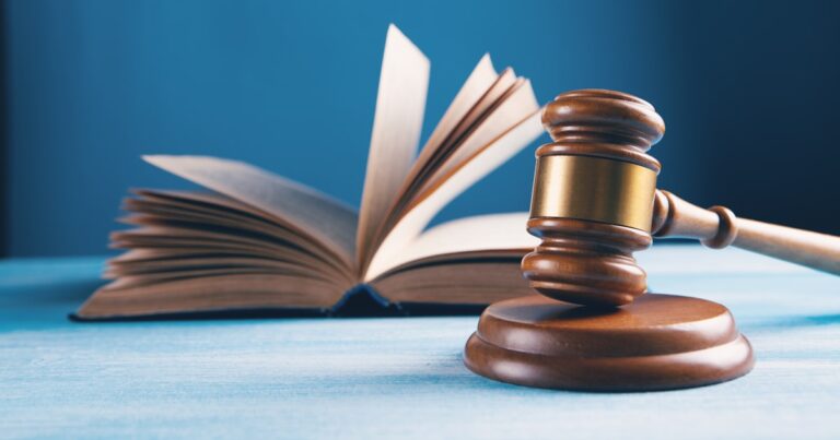 A judge’s gavel and an open law book