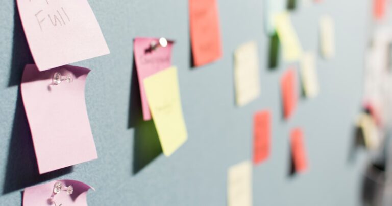 Colorful sticky notes on a board
